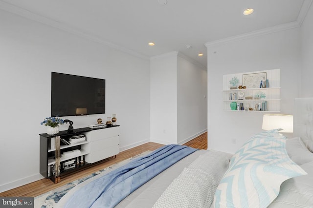 bedroom featuring hardwood / wood-style floors and crown molding