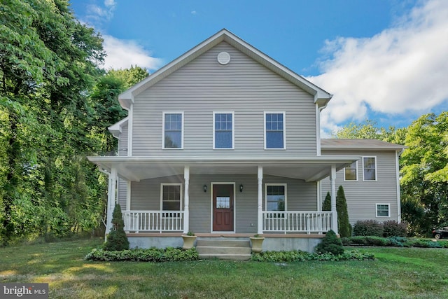 view of front facade featuring a porch and a front yard