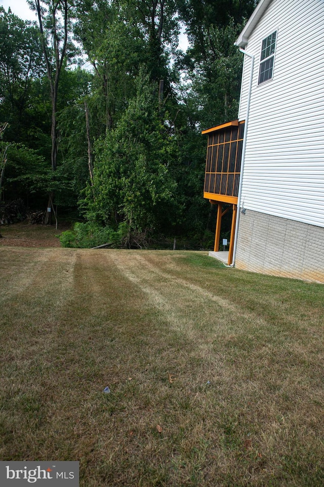 view of yard featuring a sunroom