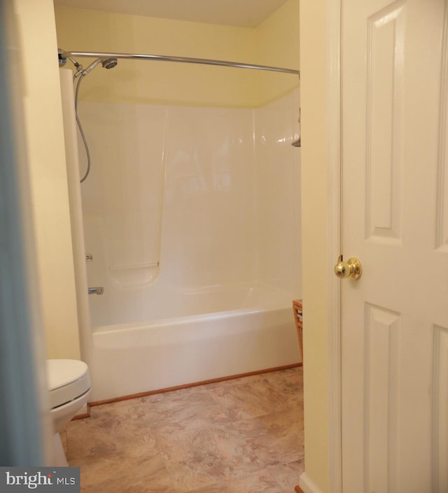 bathroom featuring toilet and walk in shower