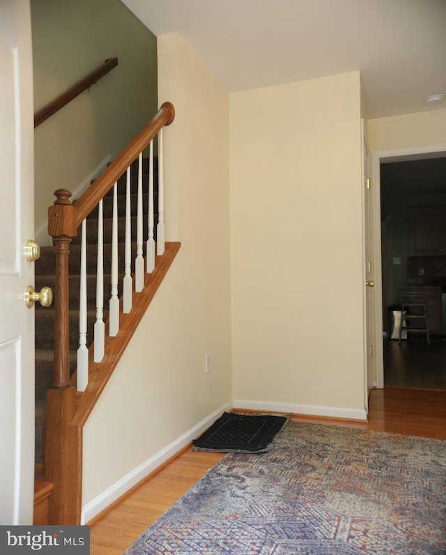 stairway featuring hardwood / wood-style floors