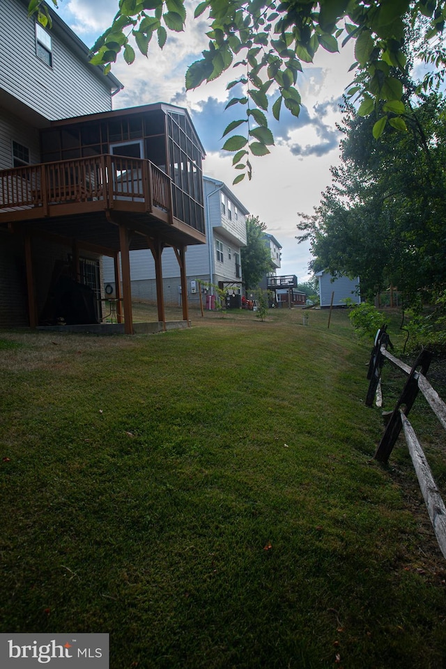 view of yard with a sunroom