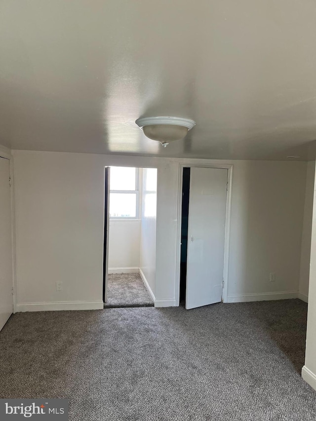 unfurnished bedroom featuring carpet