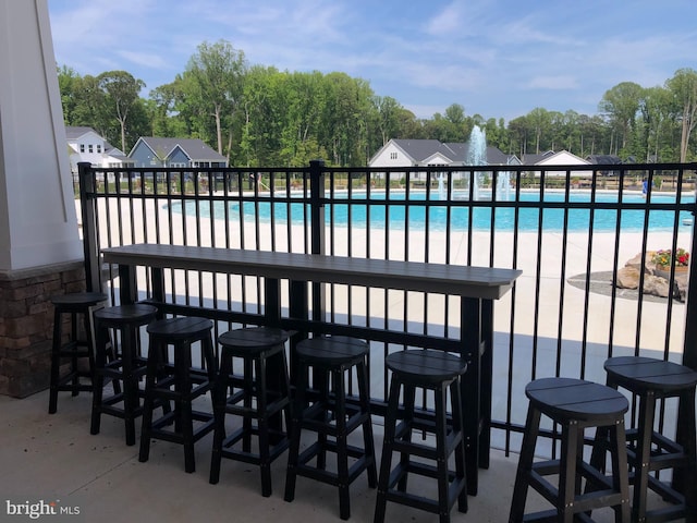 view of patio featuring a community pool