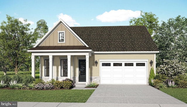 view of front of property with a garage, a porch, and a front yard