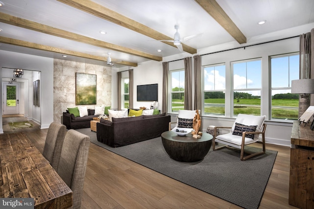 interior space with beam ceiling, dark wood-type flooring, and ceiling fan