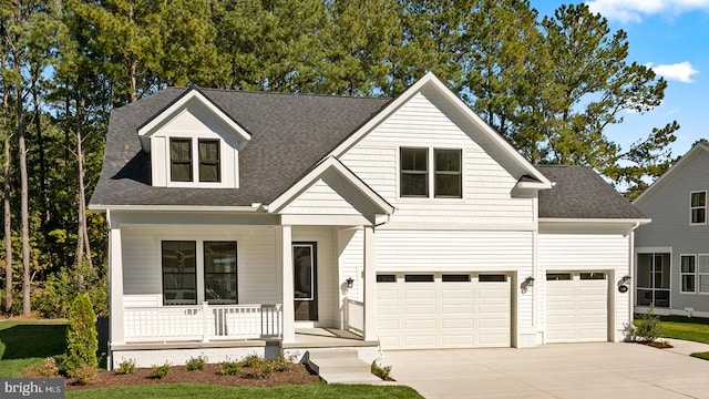 view of front of house with a garage and covered porch