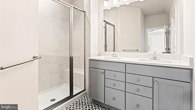 bathroom with double sink vanity, walk in shower, and tile patterned flooring