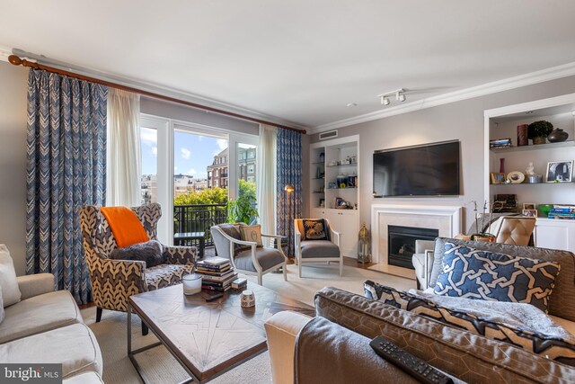 carpeted living room with crown molding and built in shelves