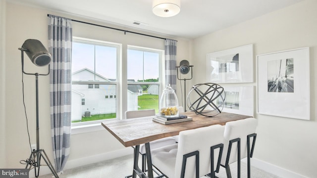 view of carpeted dining space