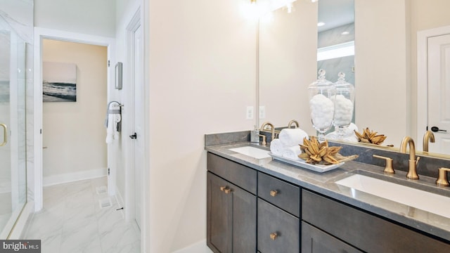 bathroom with tile patterned floors, walk in shower, and dual bowl vanity