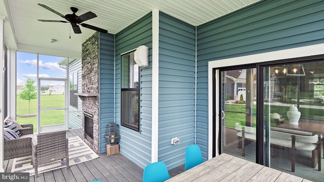 wooden deck featuring ceiling fan