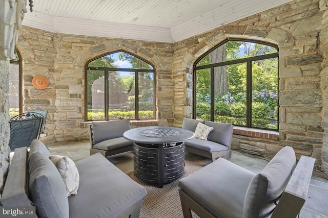 sunroom featuring wood ceiling