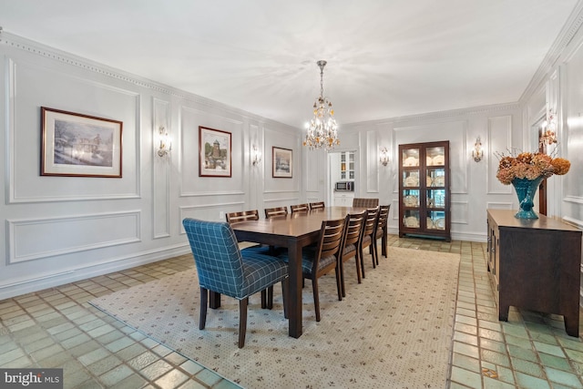 dining area featuring a notable chandelier