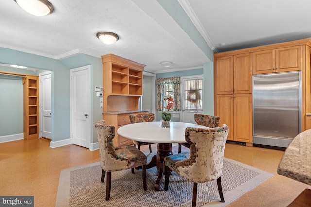 dining room featuring ornamental molding