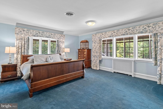 bedroom featuring radiator heating unit, ornamental molding, and dark colored carpet