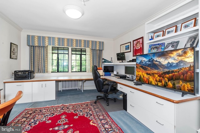 office space with built in desk, radiator heating unit, and crown molding