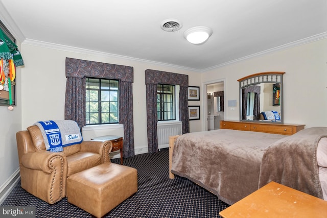 bedroom with crown molding and carpet floors