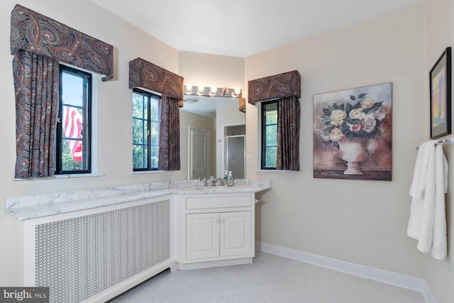 bathroom with vanity and radiator heating unit