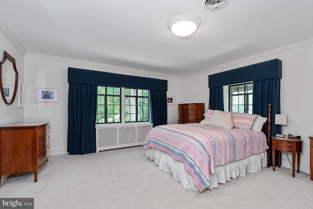 carpeted bedroom featuring ornamental molding, radiator, and multiple windows