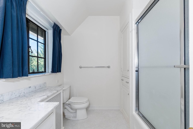 full bathroom with combined bath / shower with glass door, lofted ceiling, tile patterned flooring, vanity, and toilet