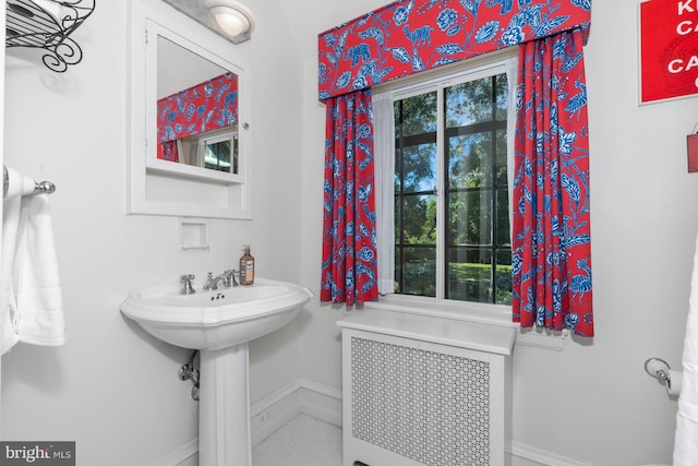 bathroom with radiator and sink