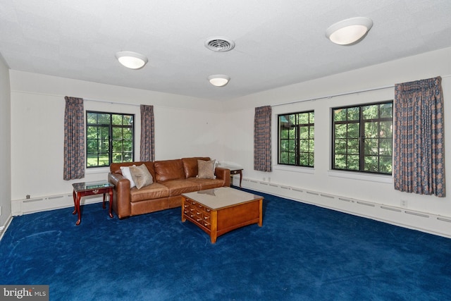 carpeted living room with a baseboard radiator and a textured ceiling