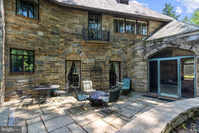 rear view of property featuring a patio