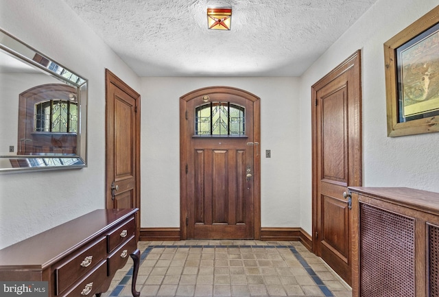 entrance foyer with a textured ceiling