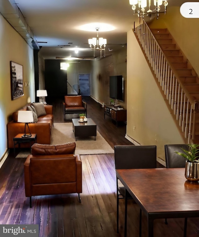 living room featuring a chandelier, a baseboard radiator, and dark hardwood / wood-style flooring