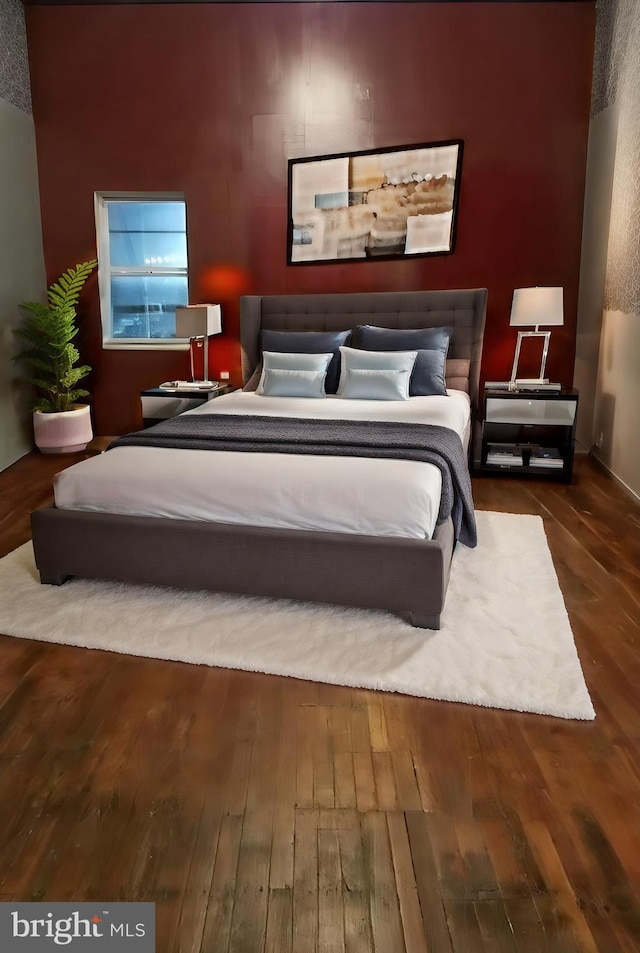 bedroom featuring hardwood / wood-style flooring