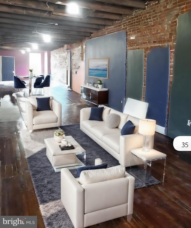 living room with brick wall and dark wood-type flooring