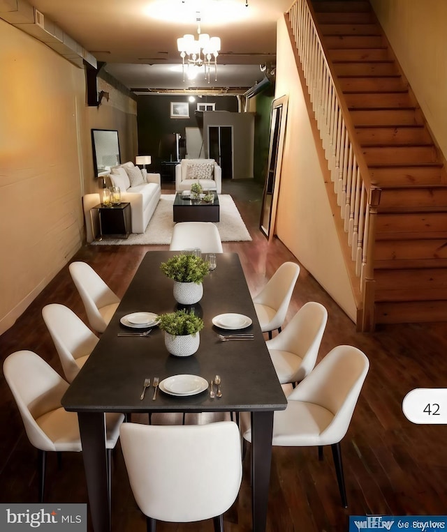 dining room featuring a notable chandelier and wood-type flooring