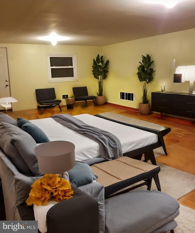 bedroom with light hardwood / wood-style floors