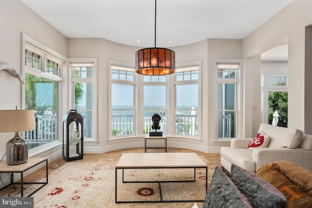 sunroom with a water view