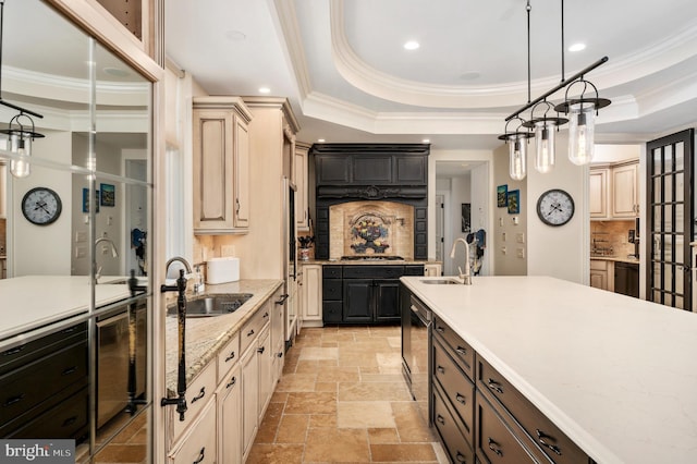 kitchen featuring stone tile flooring, a raised ceiling, a sink, and dark brown cabinets