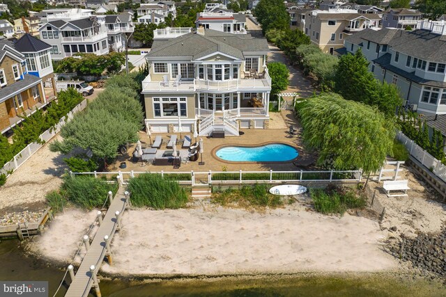 exterior space with a fenced in pool and a patio