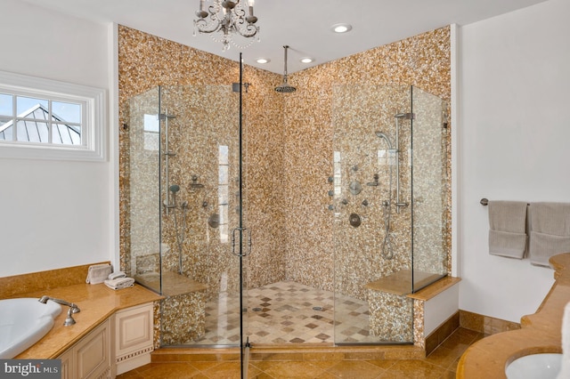 full bathroom featuring tile patterned floors, a notable chandelier, a shower stall, and a bath