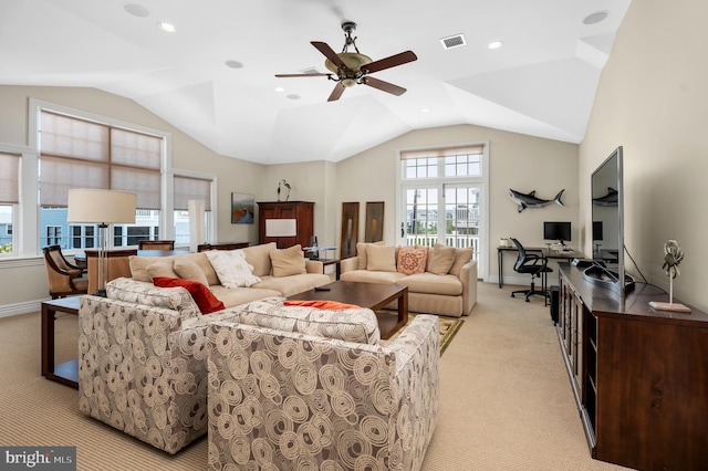 living room featuring light carpet, lofted ceiling, visible vents, and baseboards