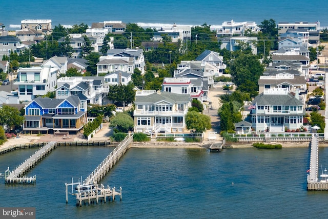 bird's eye view with a water view and a residential view