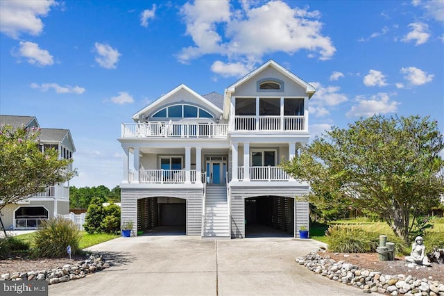 coastal inspired home with a carport and covered porch