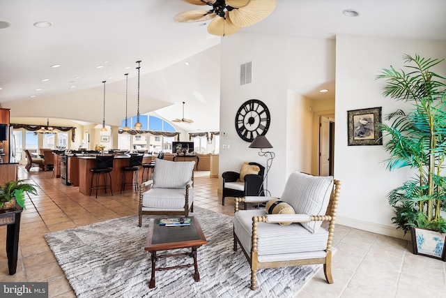 living area featuring ceiling fan, light tile patterned flooring, recessed lighting, visible vents, and baseboards