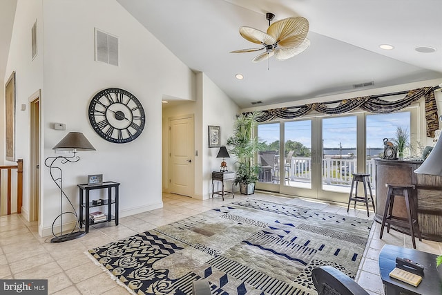 living area with high vaulted ceiling, recessed lighting, visible vents, and baseboards