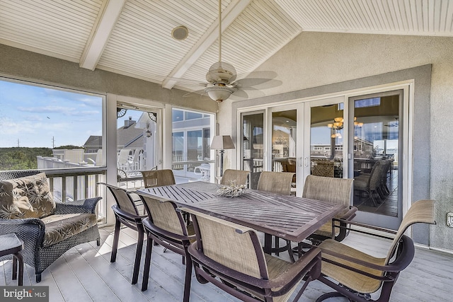 sunroom with a ceiling fan, wood ceiling, french doors, and lofted ceiling with beams