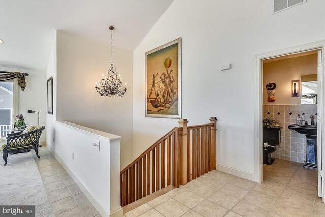 sunroom featuring ceiling fan and vaulted ceiling with beams