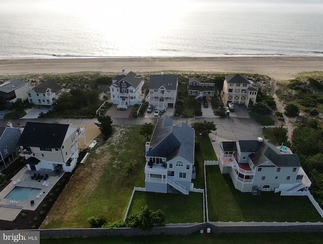 drone / aerial view with a residential view and a water view