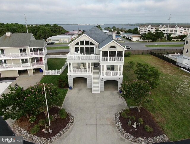 birds eye view of property with a water view