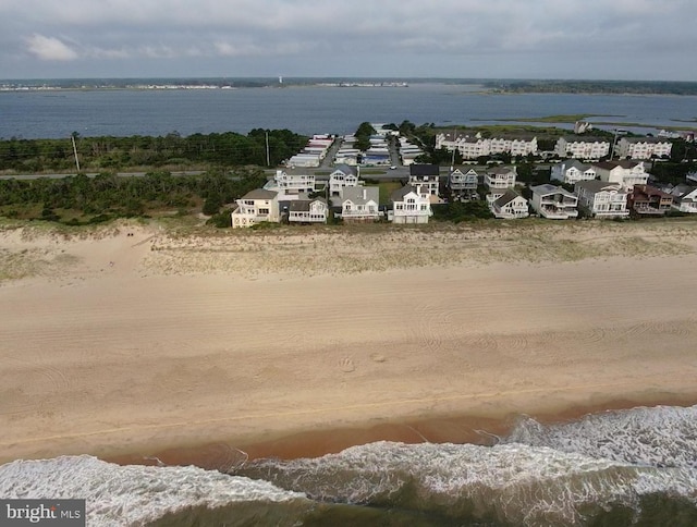 aerial view featuring a water view and a beach view