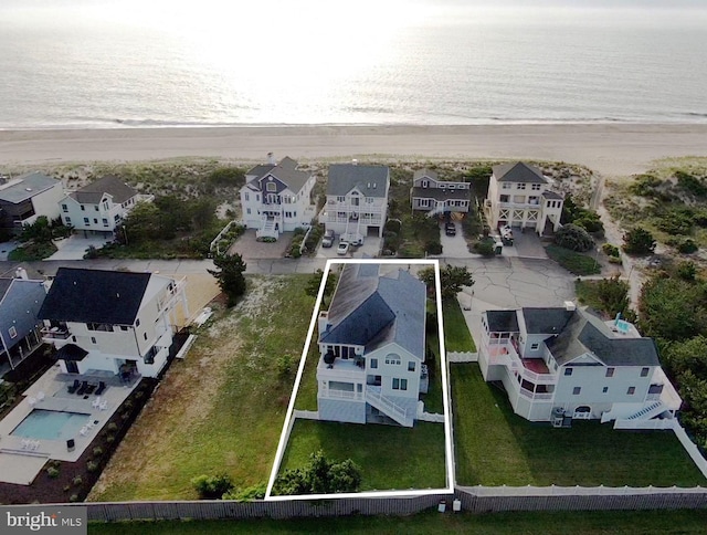 bird's eye view featuring a residential view and a water view