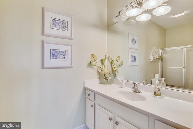 bathroom with vanity and an enclosed shower